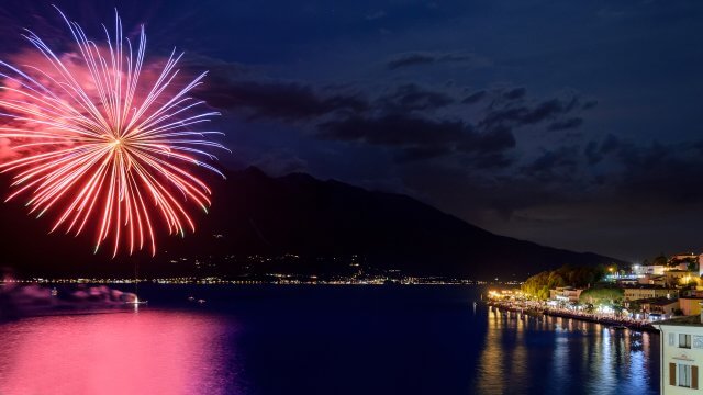 Astonishing,Fireworks,In,Limone,Sul,Garda,With,Beautiful,Colors,And